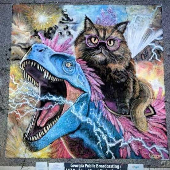Chalk street art of Mongo the blue velociraptor and Princess Donut in her crown and glasses