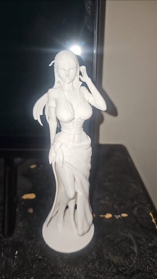 White 3D-printed figure of Nico Robin from One Piece standing on a round base
